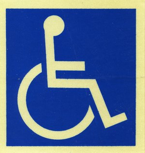 Simbolo di una persona in sedia a rotelle. 
